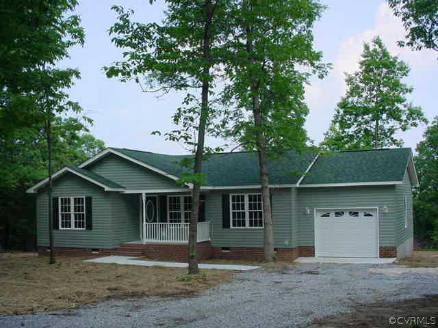 483 Rocky Mount Road Dillwyn, VA 23936 - Photo 1 of 1 a front view of a house with a yard and garage