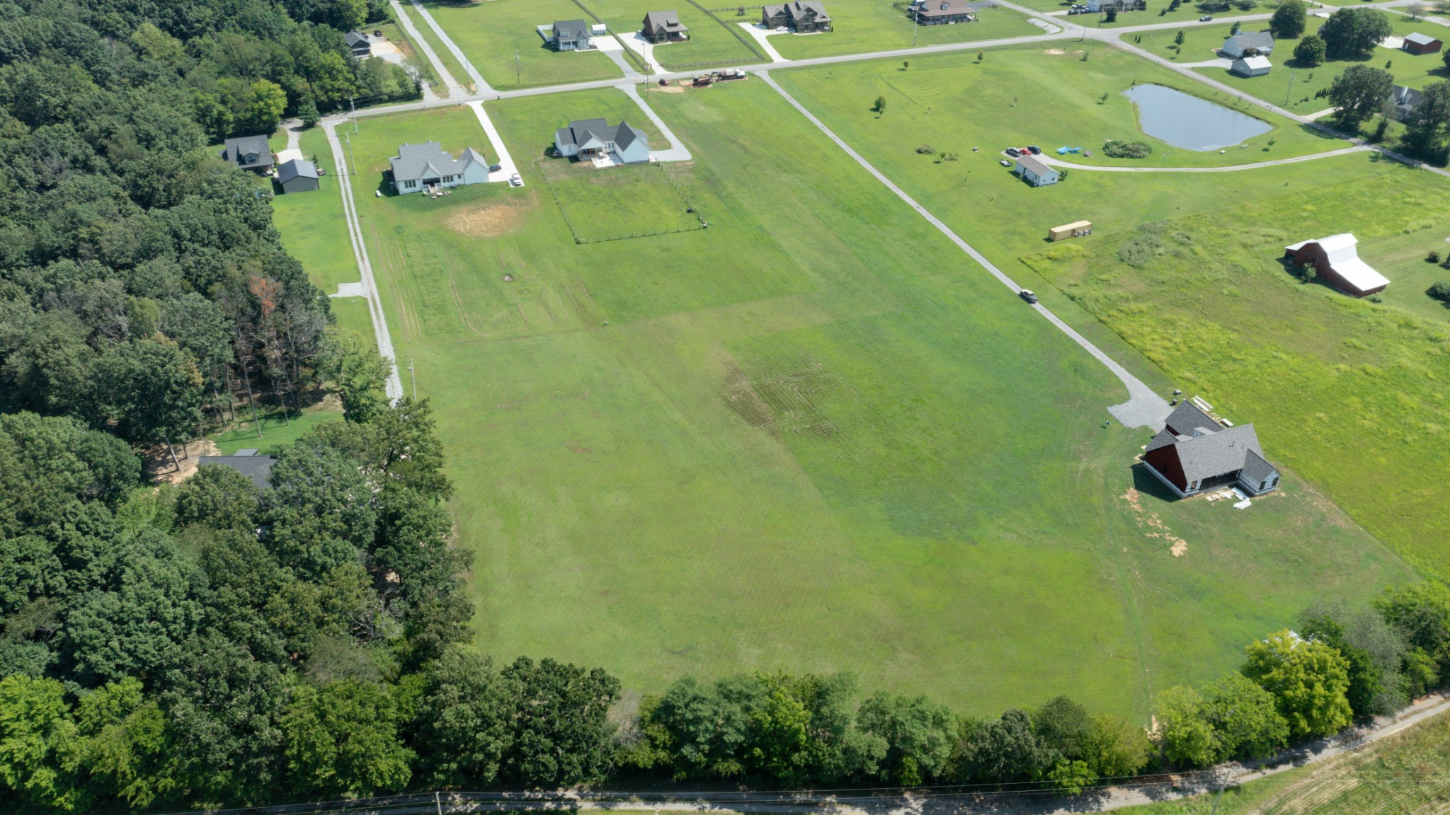 8935 Cedar Grove Road Cross Plains, TN 37049 - Photo 3 of 13 an aerial view of a residential houses with outdoor space and trees
