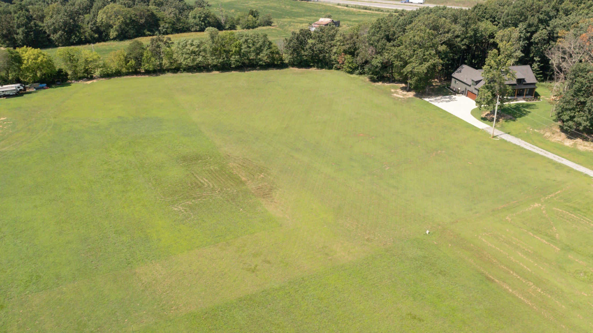 8935 Cedar Grove Road Cross Plains, TN 37049 - Photo 5 of 13 a view of a large body of water with a building in the background