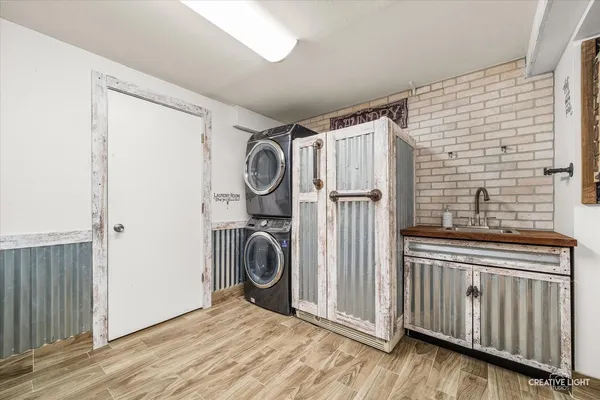 a view of a storage and utility room with stainless steel appliances