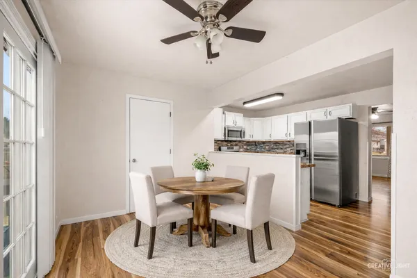 a dining room with furniture and window