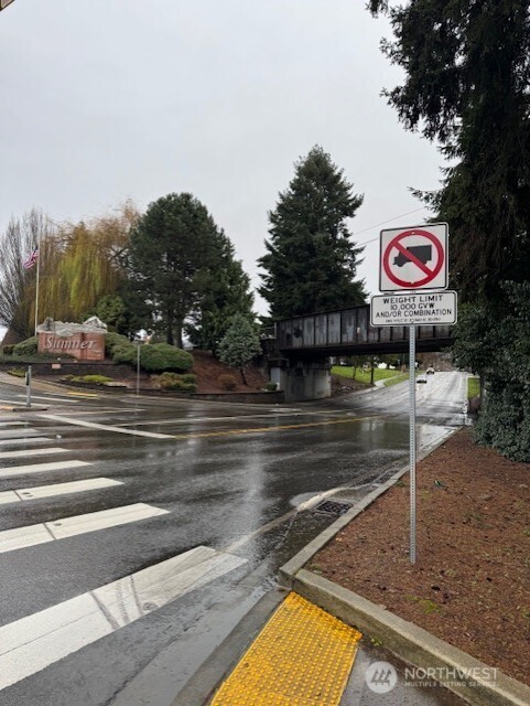 611 McKinnon Avenue Sumner, WA 98390 - Photo 3 of 8 a view of a street with cars on road