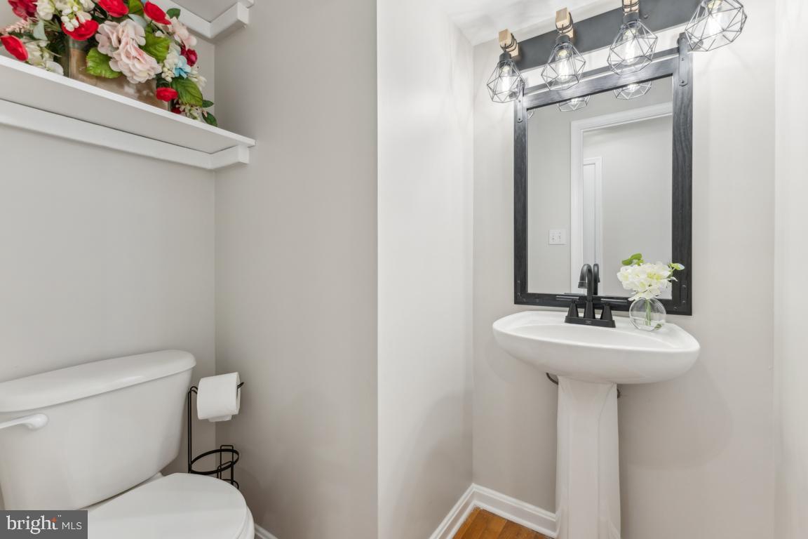 5 Basalt Drive Fredericksburg, VA 22406 - Photo 12 of 41 a bathroom with a sink a mirror and a toilet