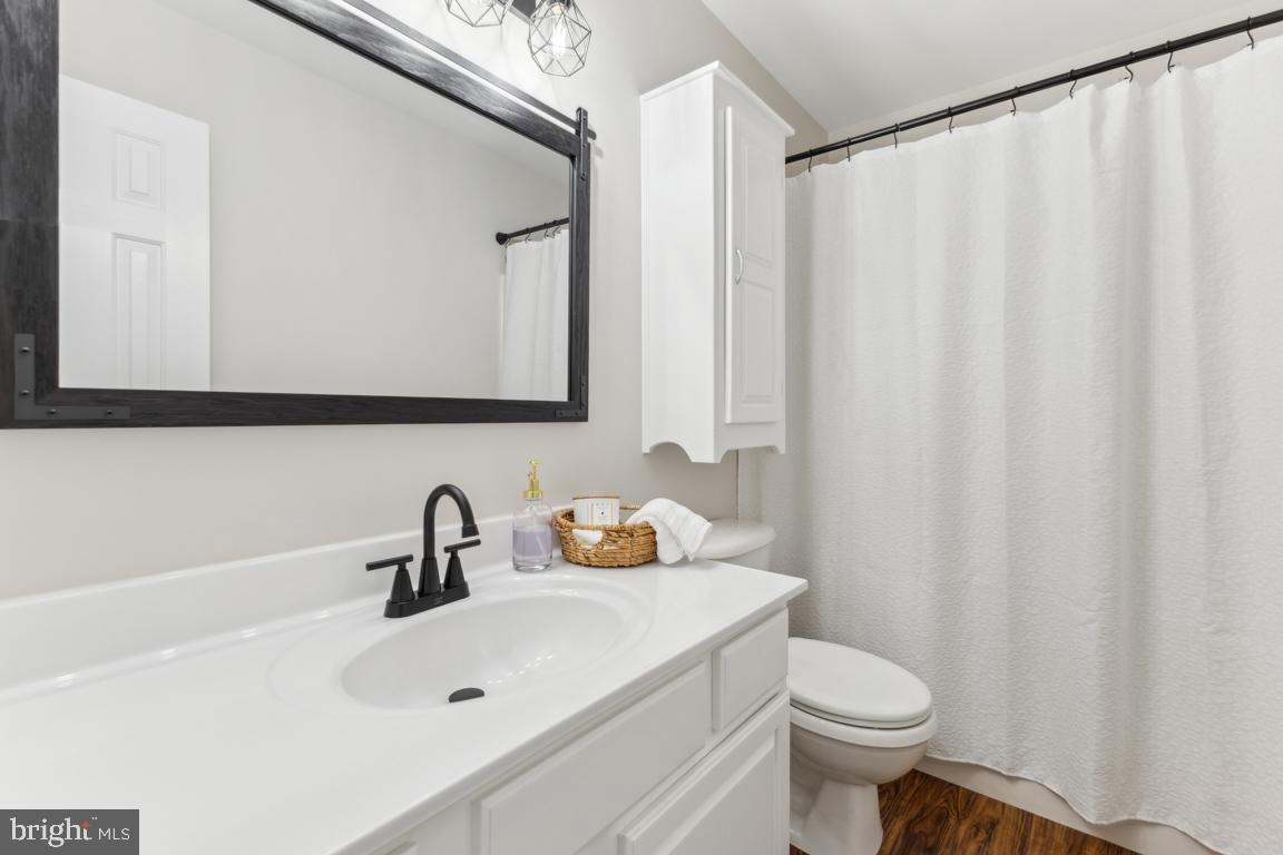 5 Basalt Drive Fredericksburg, VA 22406 - Photo 21 of 41 a bathroom with a sink a toilet and a mirror