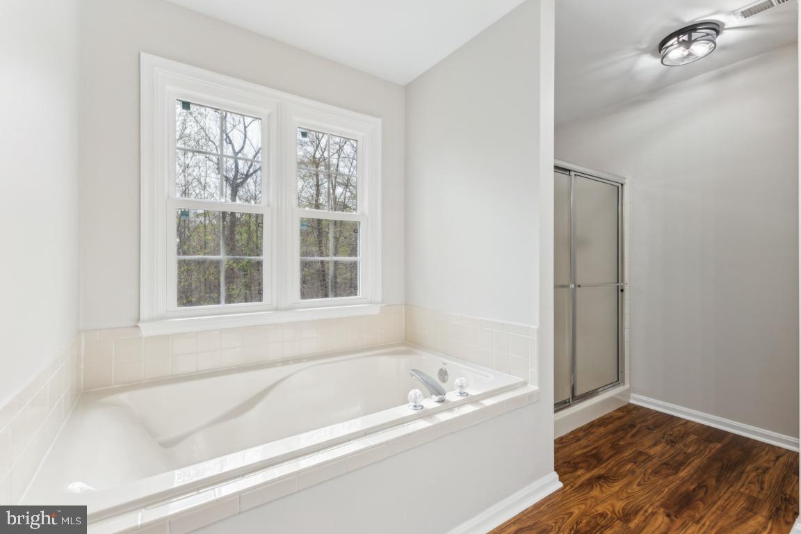 5 Basalt Drive Fredericksburg, VA 22406 - Photo 29 of 41 a bathroom with a bathtub and a window