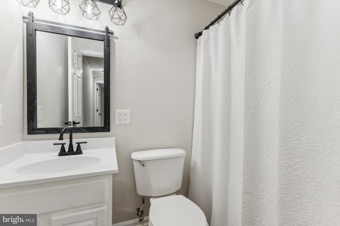 5 Basalt Drive Fredericksburg, VA 22406 - Photo 33 of 41 a bathroom with a toilet a sink and a mirror