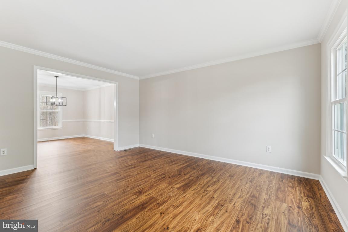 5 Basalt Drive Fredericksburg, VA 22406 - Photo 5 of 41 a view of an empty room with wooden floor and a window