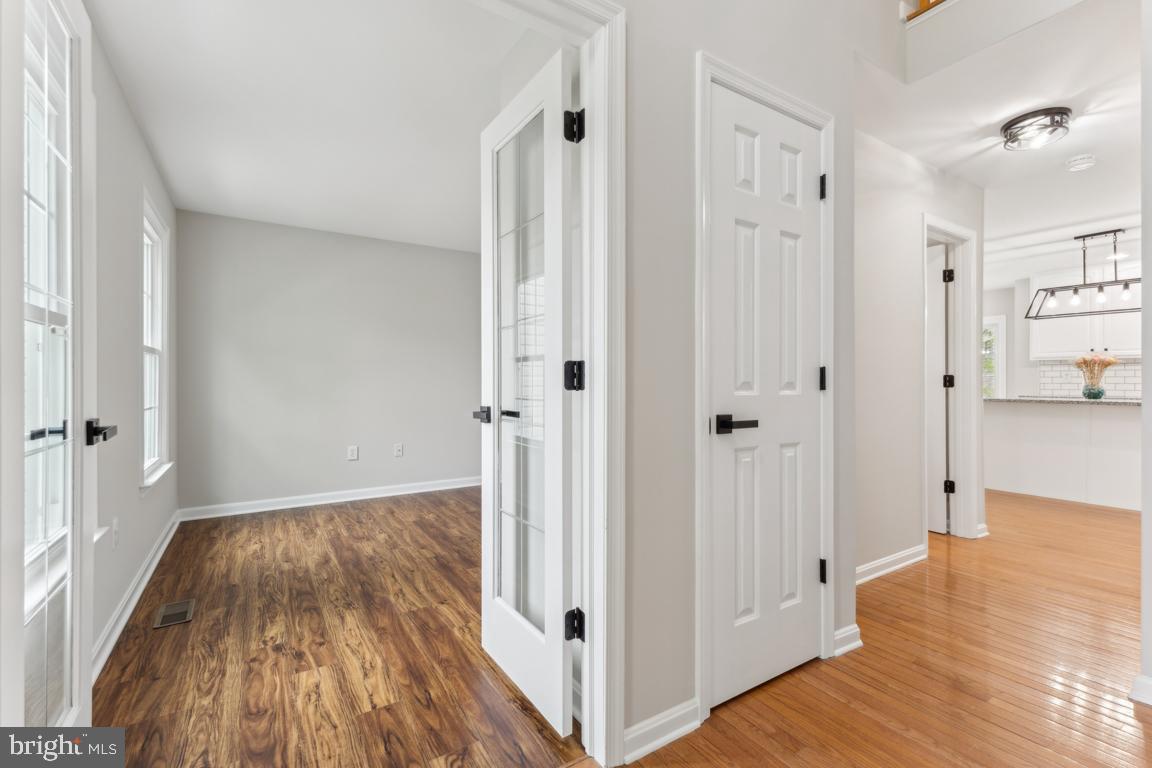 5 Basalt Drive Fredericksburg, VA 22406 - Photo 9 of 41 a view of a hallway with wooden floor and a bathroom