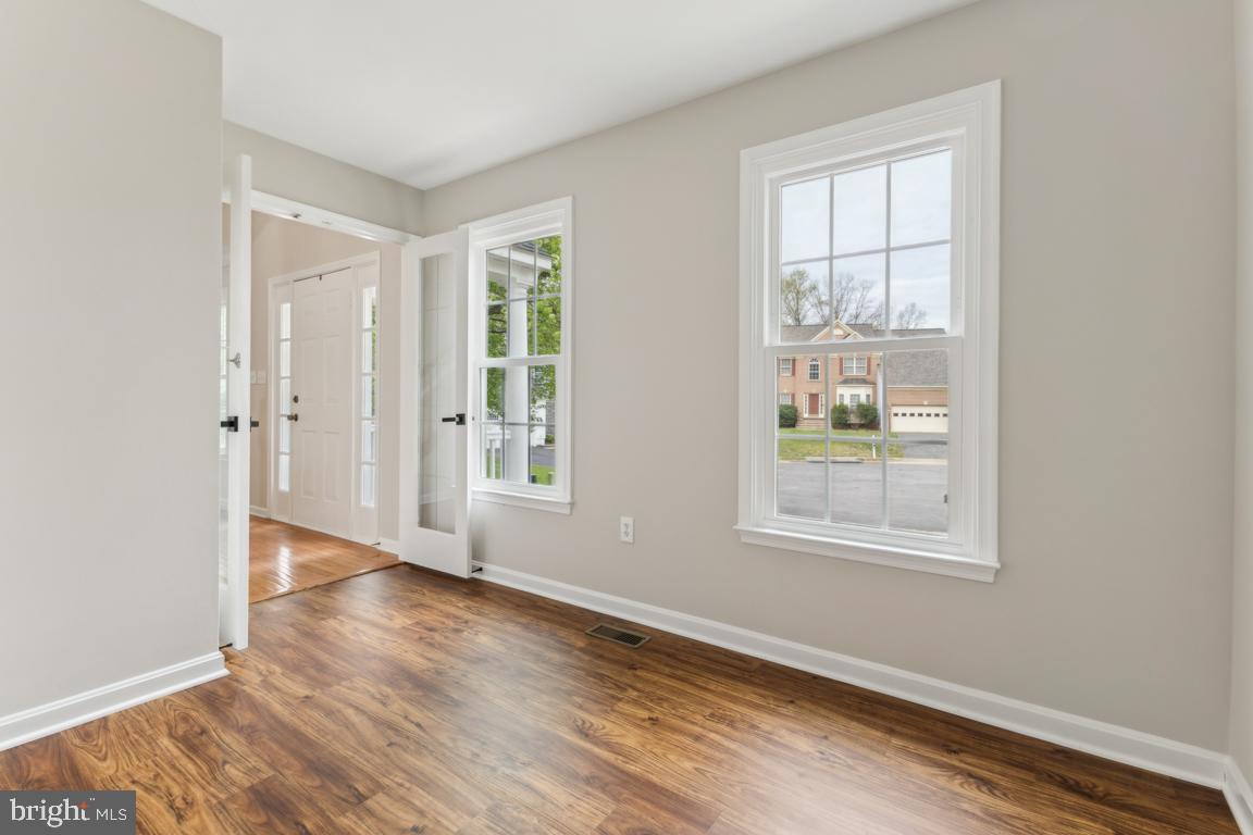 5 Basalt Drive Fredericksburg, VA 22406 - Photo 10 of 41 an empty room with wooden floor and windows