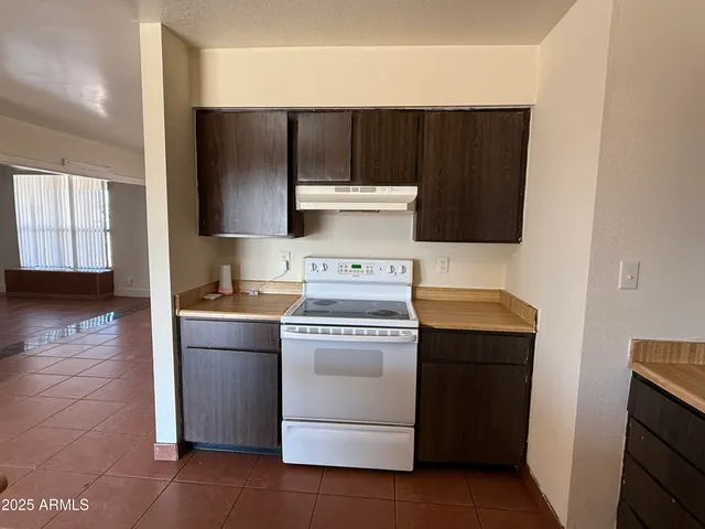 a kitchen with a stove and a microwave
