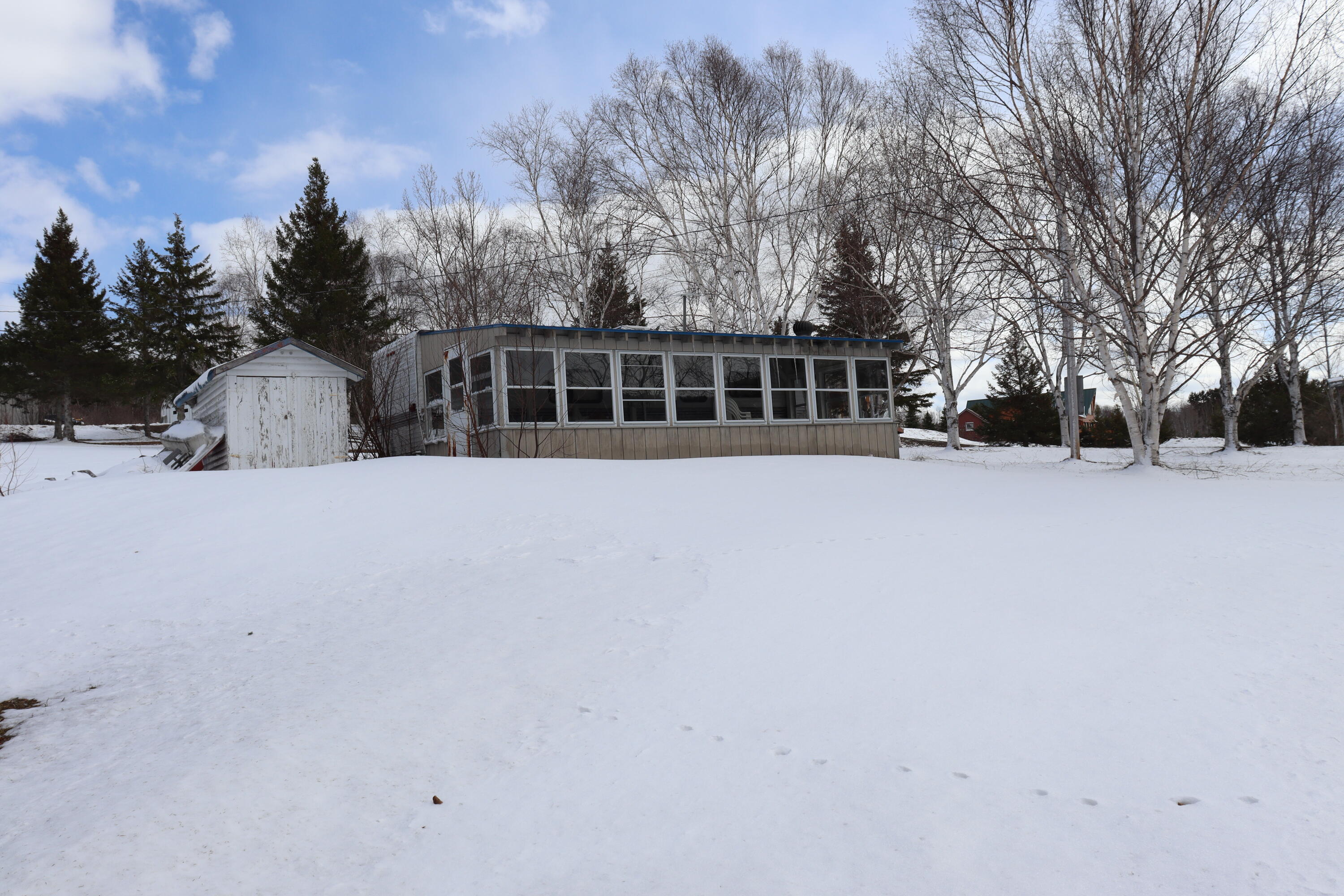 1391 Sly Brook Road Eagle Lake, ME 04739 - Photo 9 of 24 View from Lake shore of sunroom