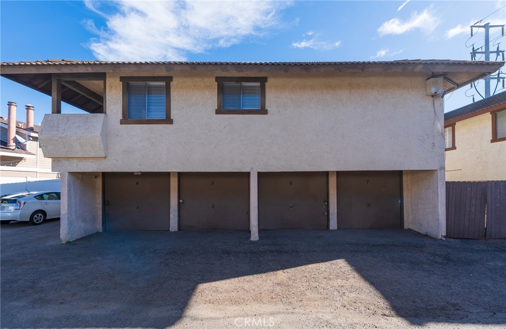2155 Canyon Drive, Unit D Costa Mesa, CA 92627 - Photo 22 of 27 a front view of a house with a garage