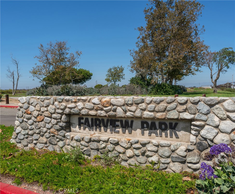 2155 Canyon Drive, Unit D Costa Mesa, CA 92627 - Photo 24 of 27 a view of a bench in the backyard