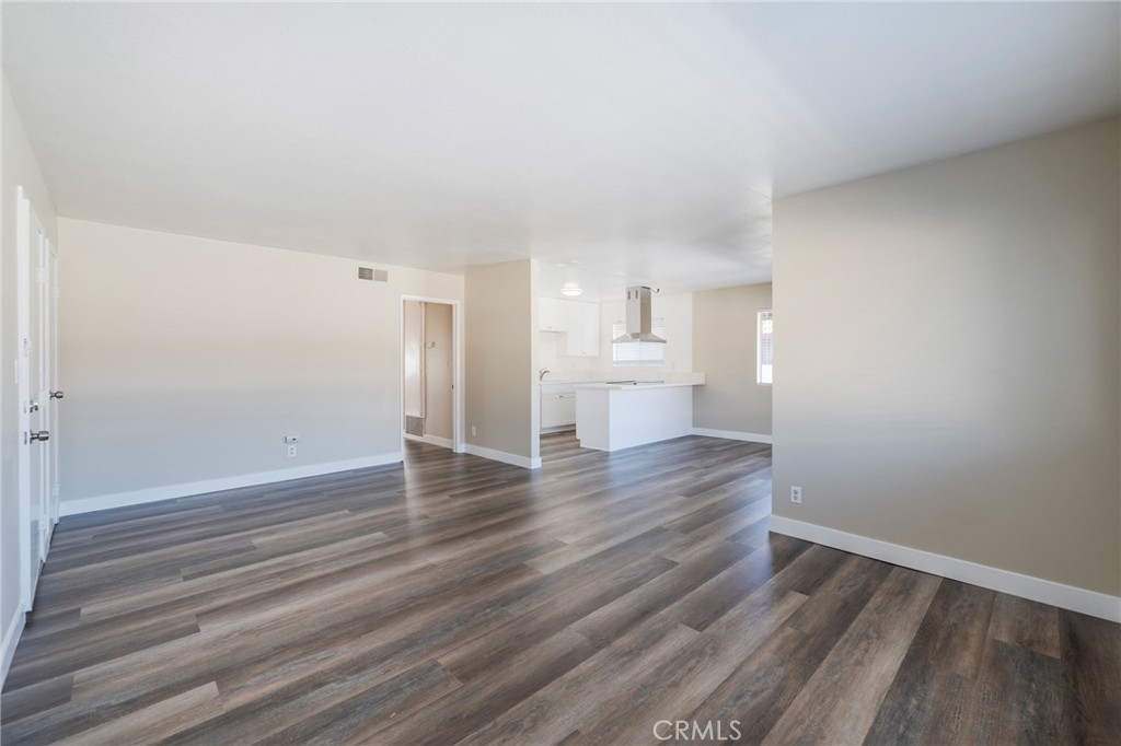 2155 Canyon Drive, Unit D Costa Mesa, CA 92627 - Photo 5 of 27 a view of empty room with wooden floor
