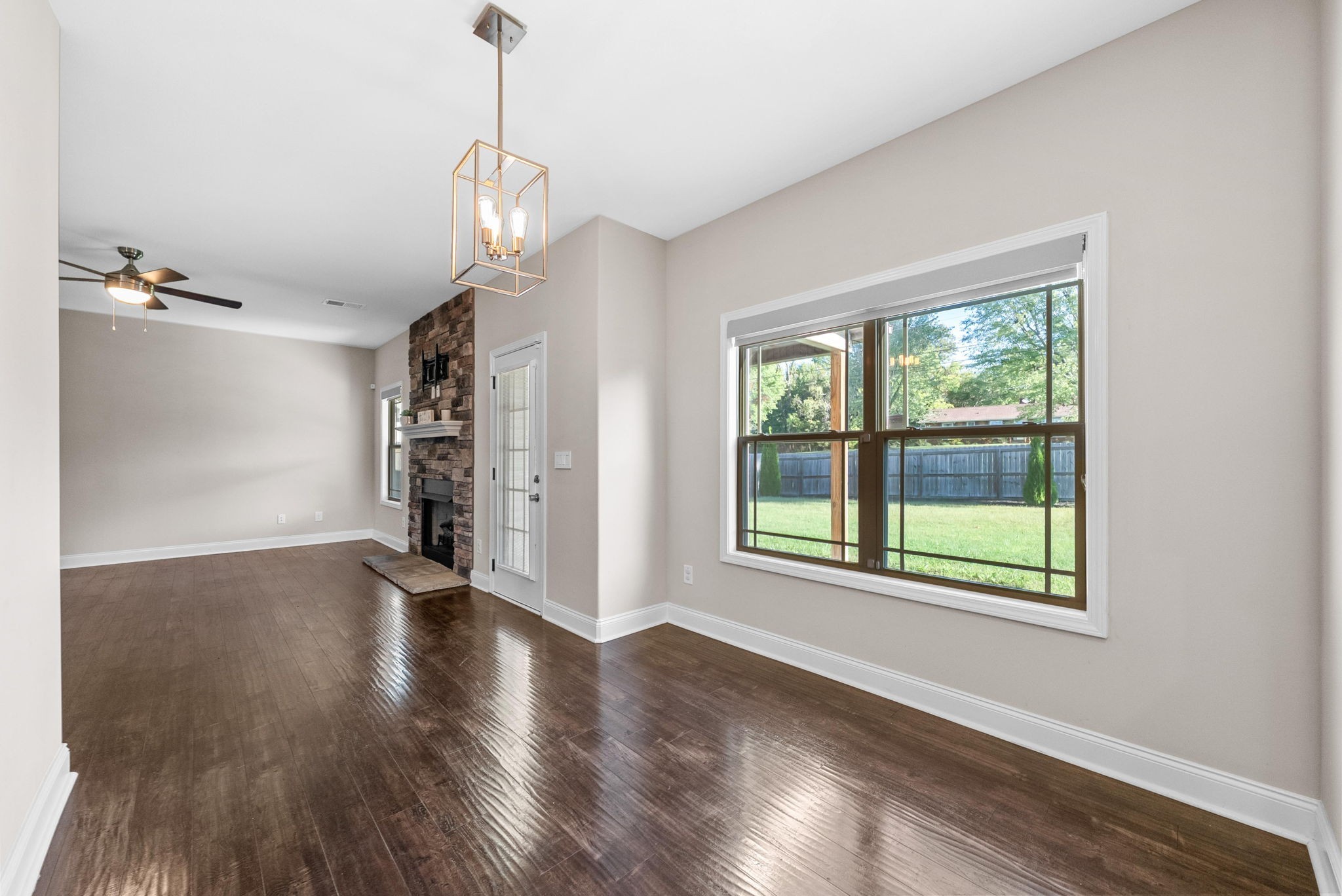 1197 Ewing Way Clarksville, TN 37043 - Photo 13 of 45 a view of an empty room with wooden floor and a window