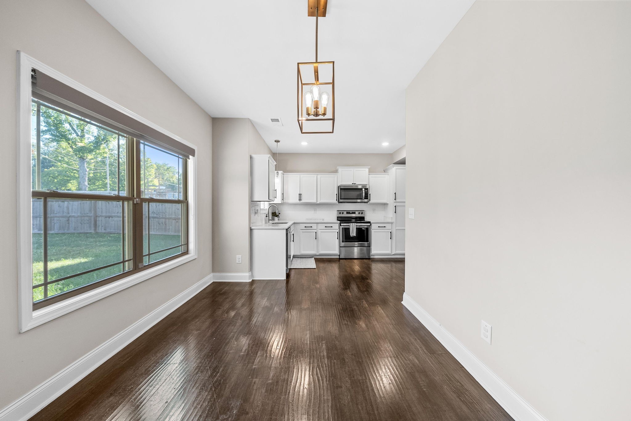 1197 Ewing Way Clarksville, TN 37043 - Photo 14 of 45 a view of a kitchen with wooden floor electronic appliances and windows