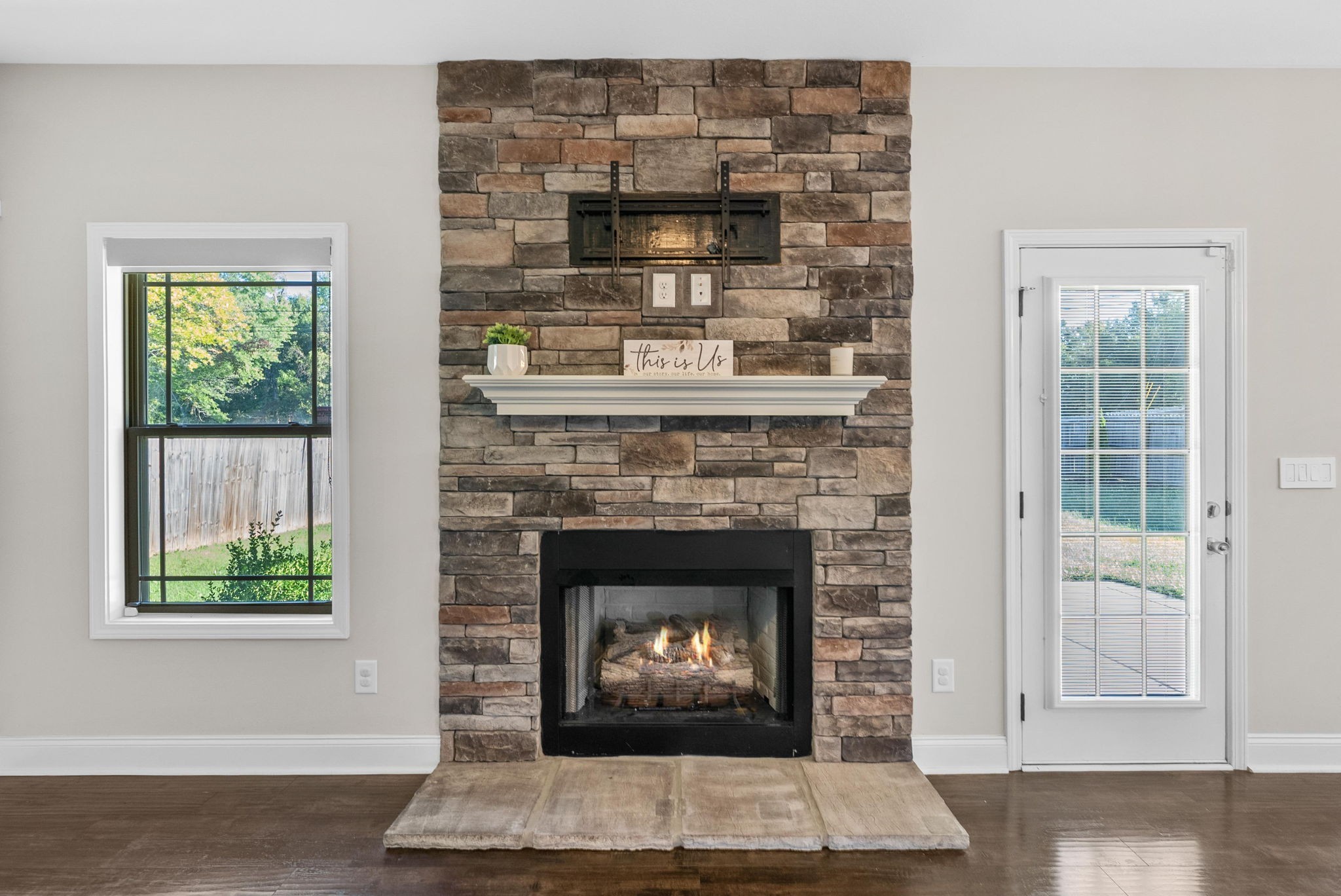 1197 Ewing Way Clarksville, TN 37043 - Photo 16 of 45 a living room with a fireplace and a window