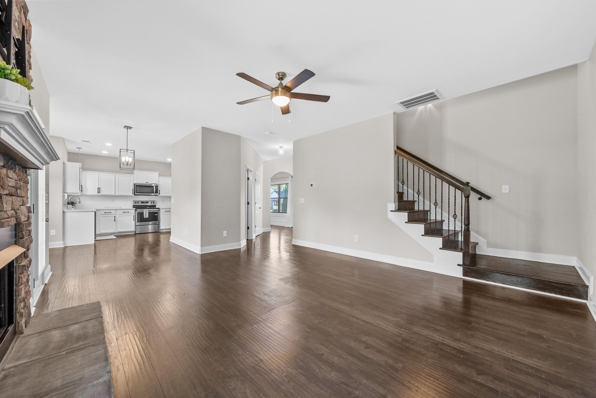 1197 Ewing Way Clarksville, TN 37043 - Photo 18 of 45 a view of an empty room with a window and wooden floor