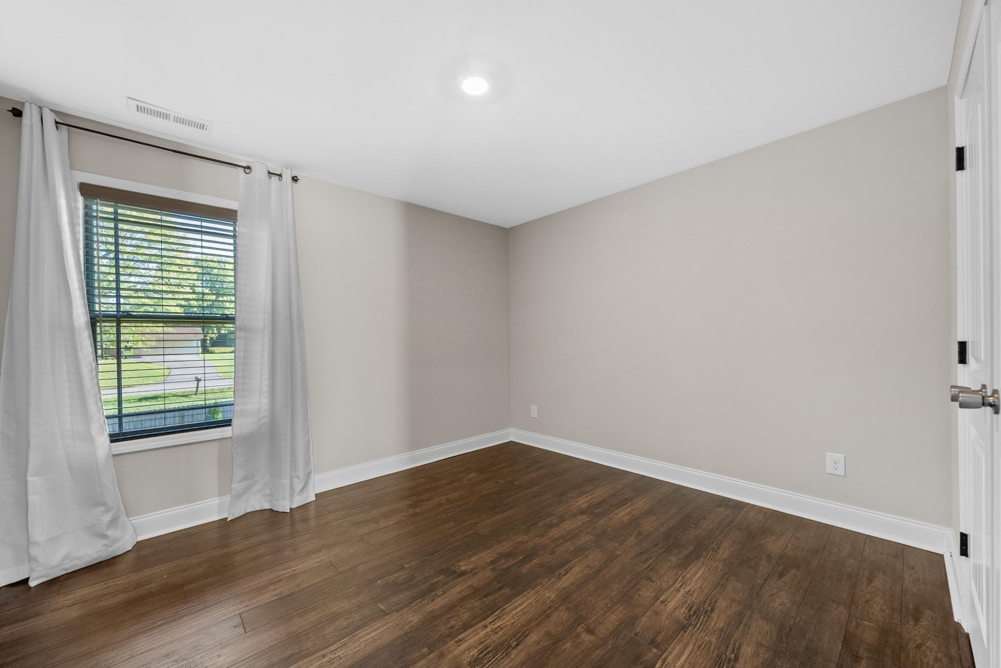 1197 Ewing Way Clarksville, TN 37043 - Photo 34 of 45 wooden floor in an empty room with a window