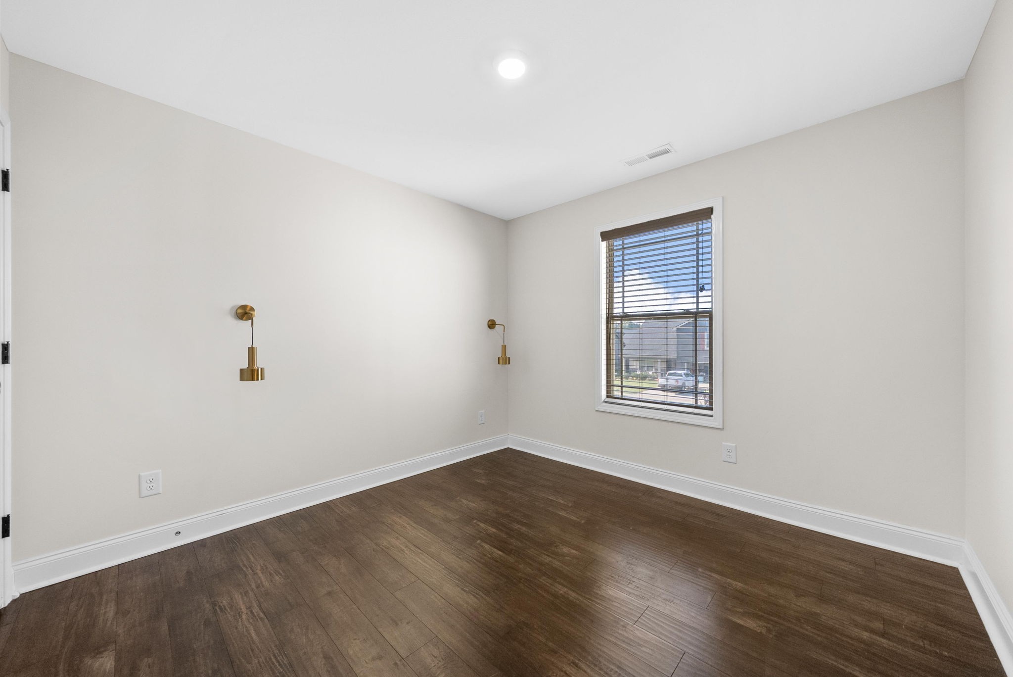 1197 Ewing Way Clarksville, TN 37043 - Photo 36 of 45 an empty room with wooden floor and windows
