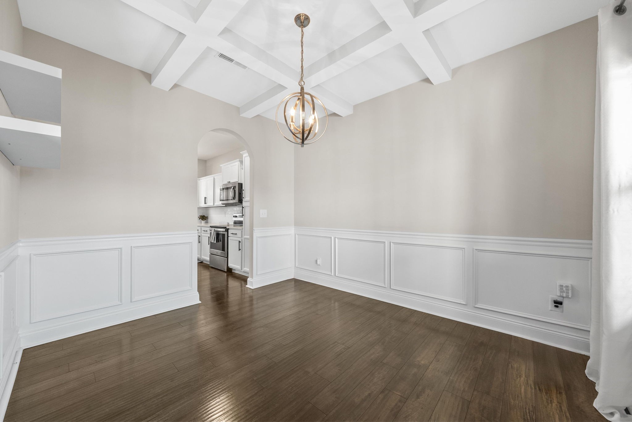 1197 Ewing Way Clarksville, TN 37043 - Photo 7 of 45 a view of a kitchen with wooden floor and a ceiling fan