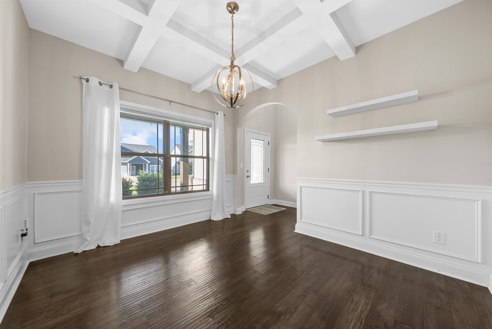 1197 Ewing Way Clarksville, TN 37043 - Photo 8 of 45 a view of an empty room with wooden floor and a window