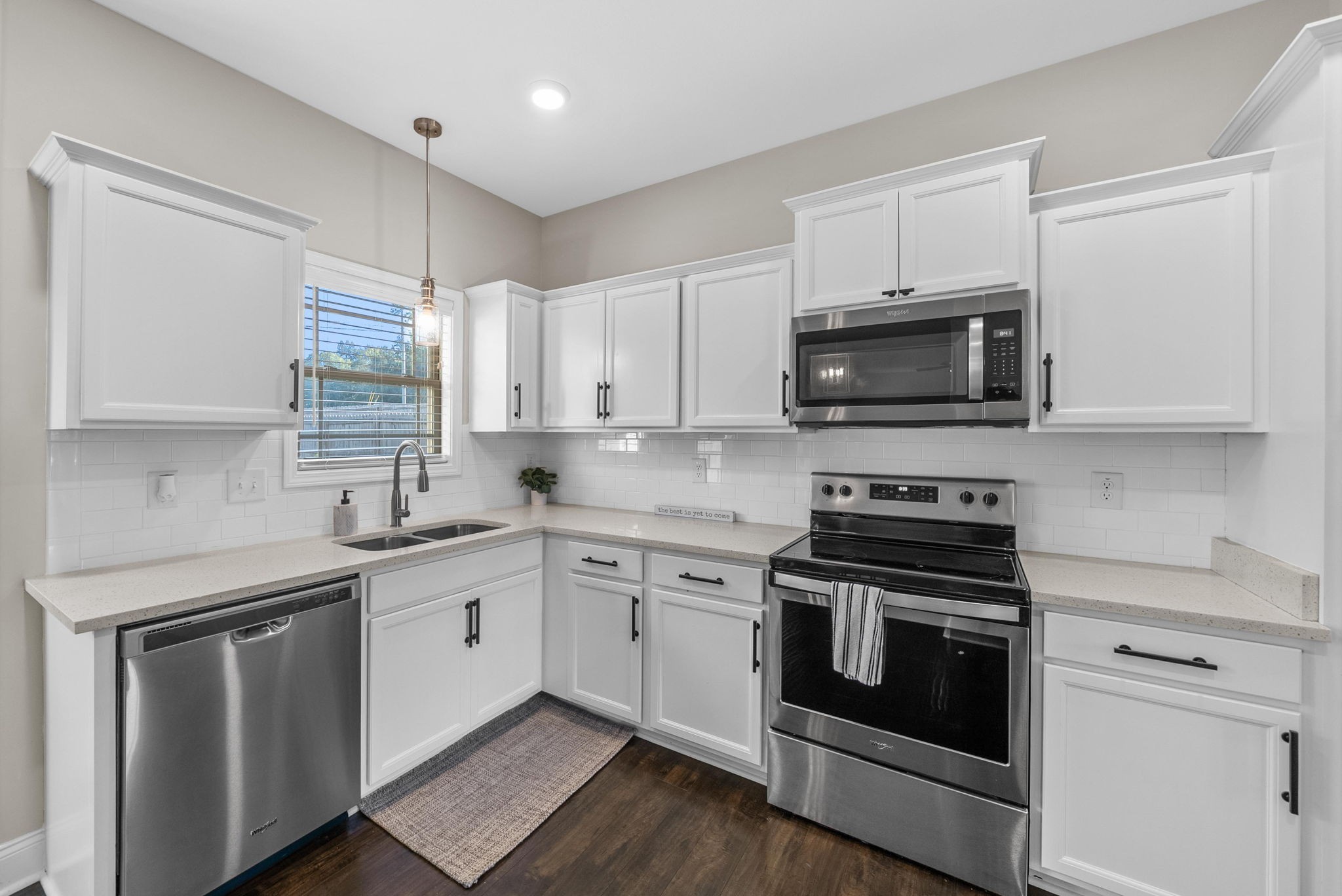 1197 Ewing Way Clarksville, TN 37043 - Photo 10 of 45 a kitchen with cabinets stainless steel appliances and wooden floor