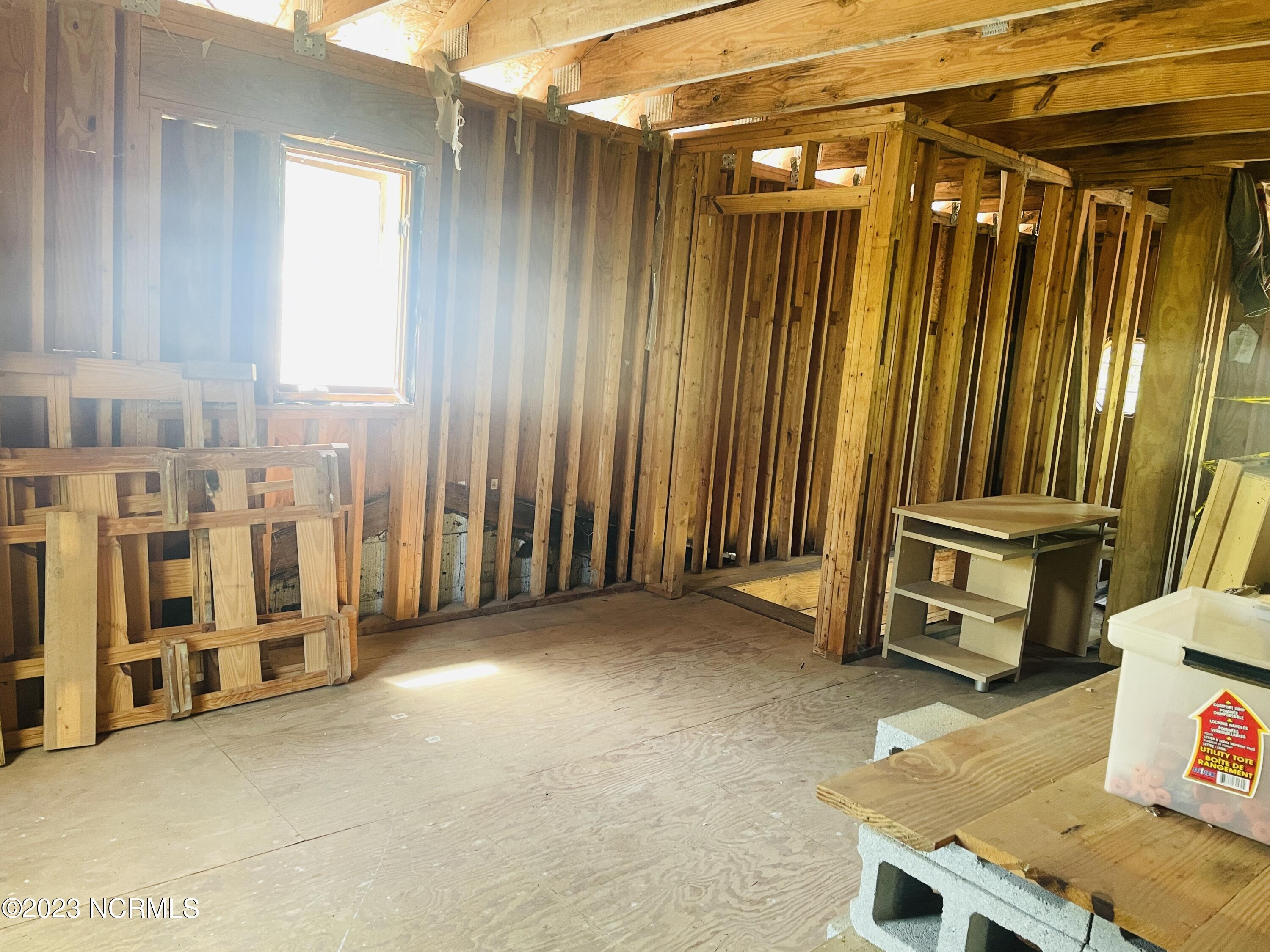 6185 Rough And Ready Road Chadbourn, NC 28431 - Photo 43 of 78 Solid staircase brings you up into a second floor with space for two guest bedrooms.