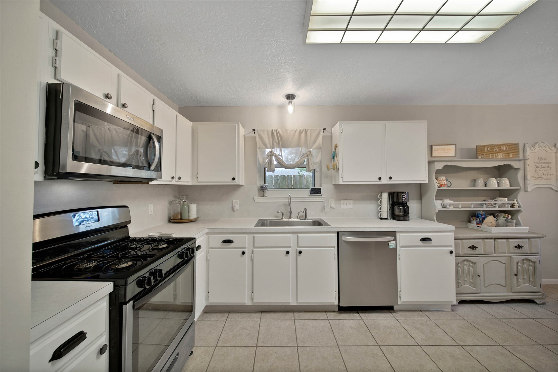 4843 Drew Forest Lane Humble, TX 77346 - Photo 6 of 21 The kitchen features recently updated stainless steel appliances including a gas range and a large sink.
