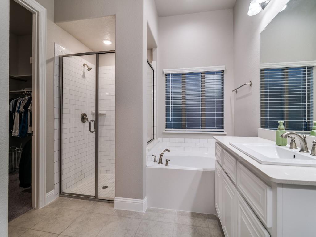 3323 Royal Ridge Drive Rockwall, TX 75087 - Photo 18 of 40 Full bath featuring vanity, a shower stall, a garden tub, tile patterned flooring, and a walk in closet