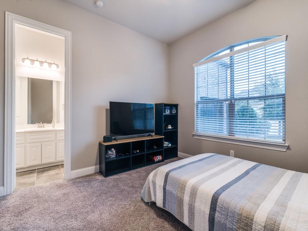 3323 Royal Ridge Drive Rockwall, TX 75087 - Photo 21 of 40 2nd primary/ M.I.L. FIRST FLOOR bedroom with multiple windows and ensuite bathroom