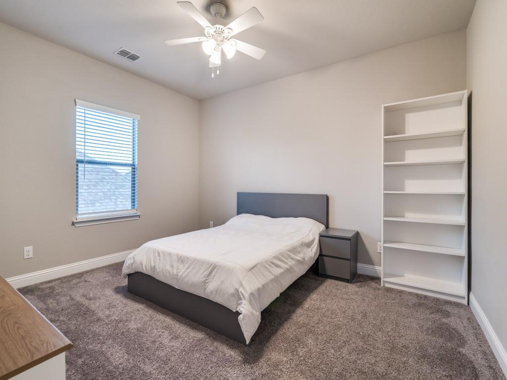 3323 Royal Ridge Drive Rockwall, TX 75087 - Photo 23 of 40 2nd level Carpeted bedroom 3 featuring a ceiling fan