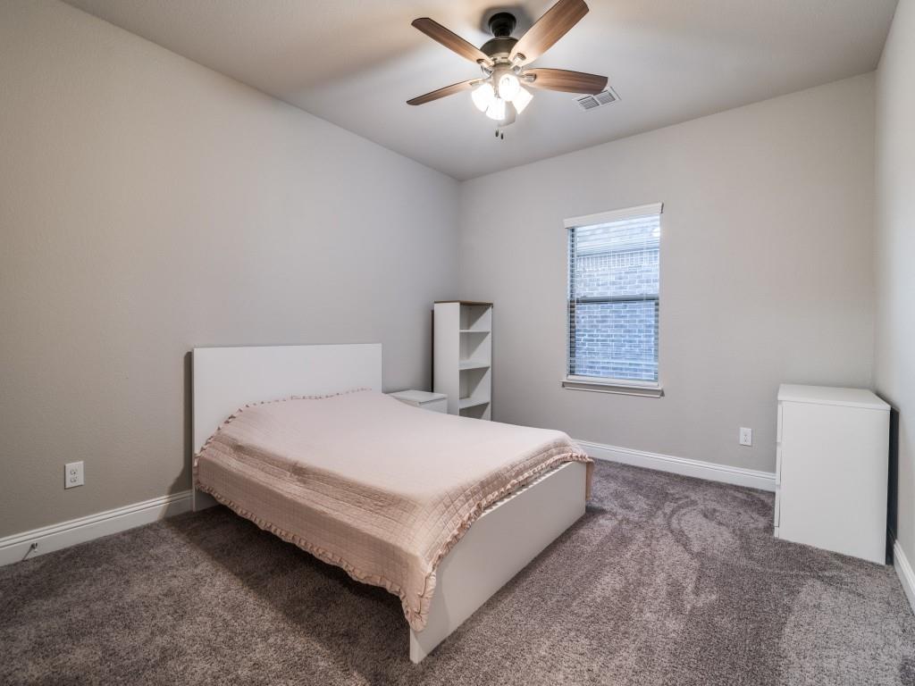 3323 Royal Ridge Drive Rockwall, TX 75087 - Photo 24 of 40 2nd level Carpeted bedroom 4 featuring a ceiling fan