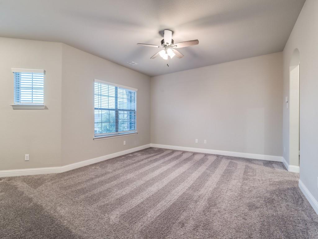 3323 Royal Ridge Drive Rockwall, TX 75087 - Photo 28 of 40 2nd level Carpeted spare room with a ceiling fan and plenty of natural light