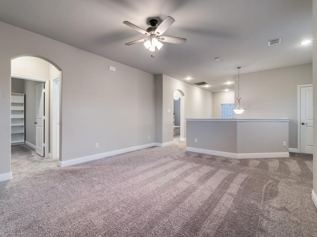 3323 Royal Ridge Drive Rockwall, TX 75087 - Photo 29 of 40 2nd level Spare room featuring arched walkways, ceiling fan, light colored carpet, and recessed lighting