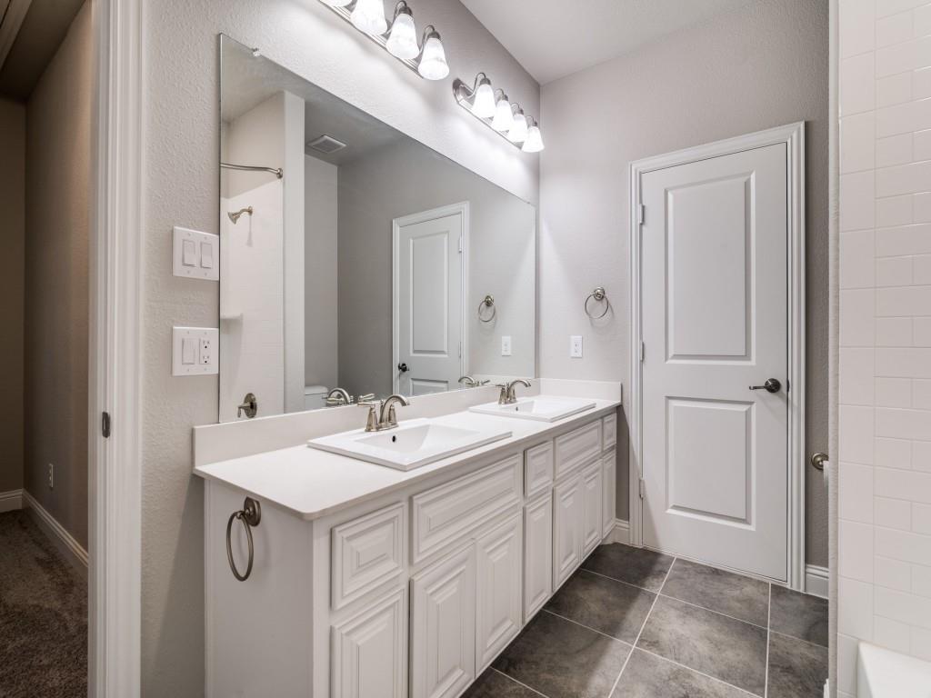 3323 Royal Ridge Drive Rockwall, TX 75087 - Photo 30 of 40 2nd level Full Bathroom #3 with double vanity and tile patterned floors