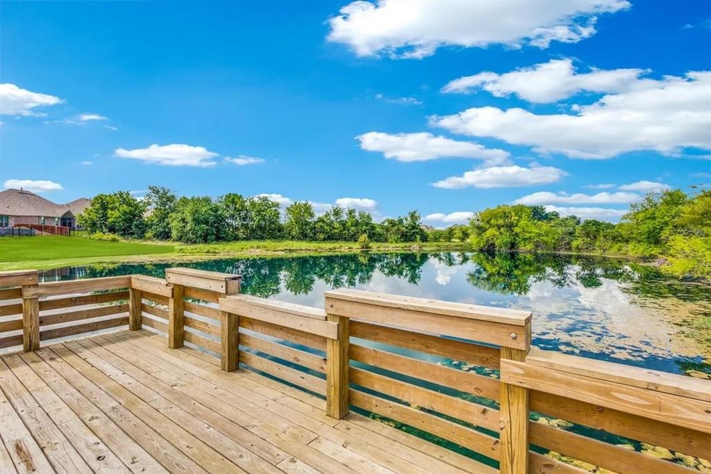 3323 Royal Ridge Drive Rockwall, TX 75087 - Photo 34 of 40 Wooden terrace with a water view and view of scattered trees