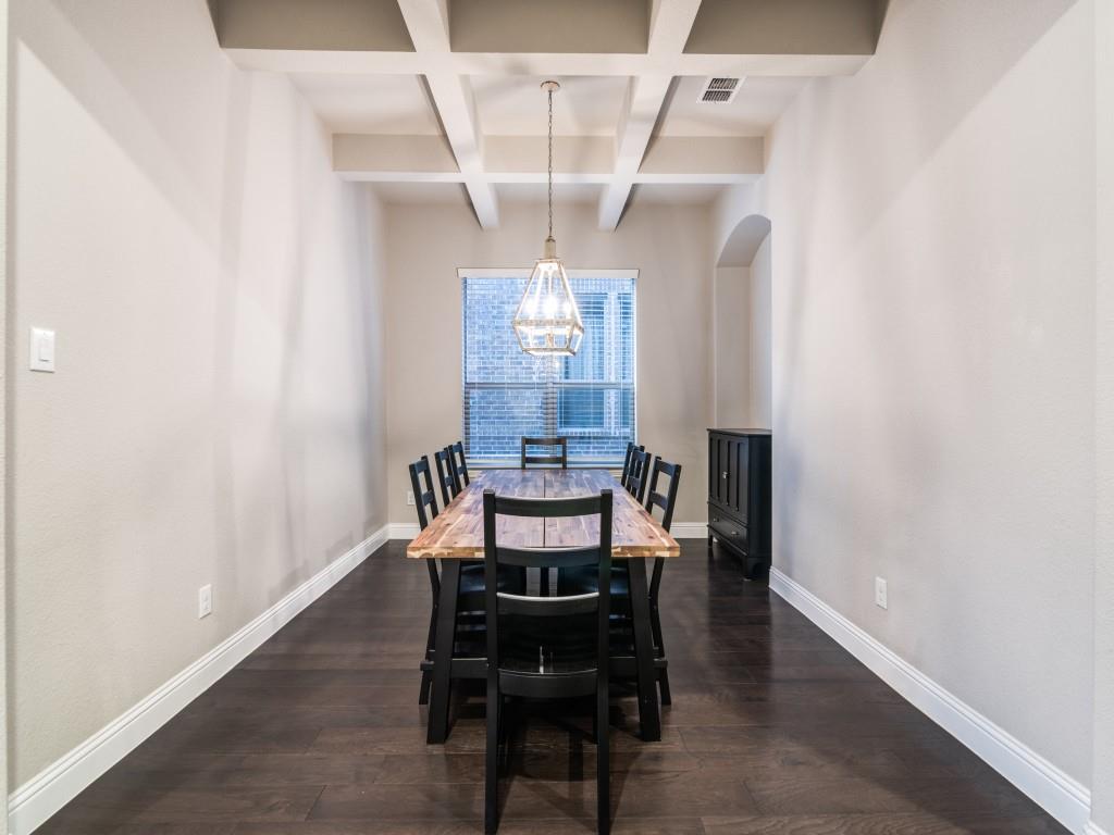 3323 Royal Ridge Drive Rockwall, TX 75087 - Photo 8 of 40 Formal Dining space with a chandelier, coffered ceiling, beamed ceiling, and dark wood-type flooring