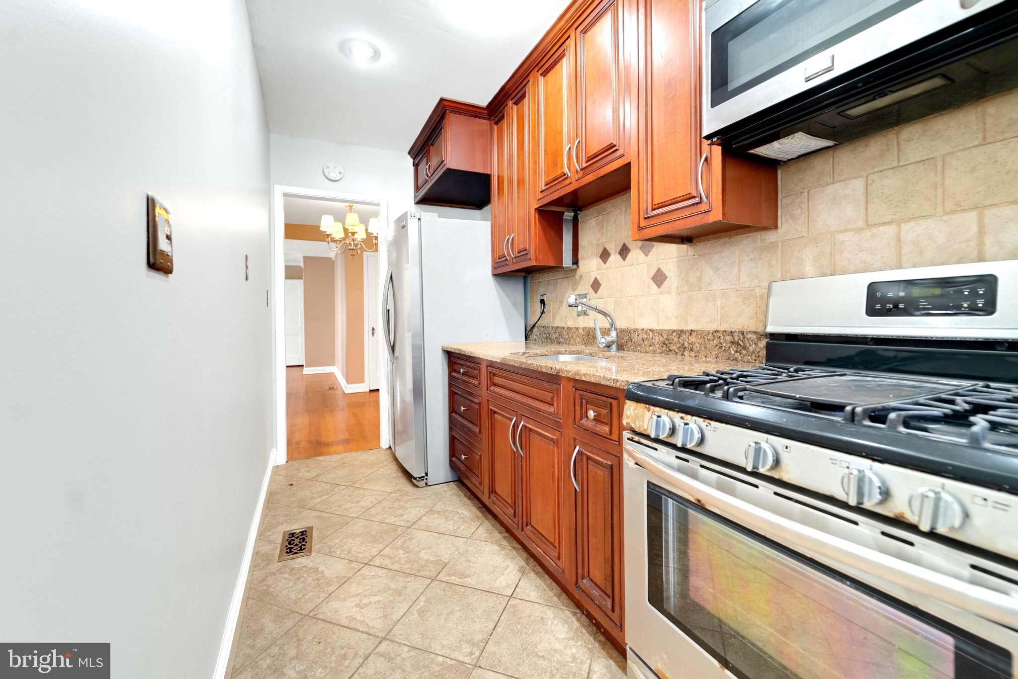 19 Hamilton Street Northeast, Unit 1 Washington, DC 20011 - Photo 9 of 17 Charming kitchen with modern finishes.