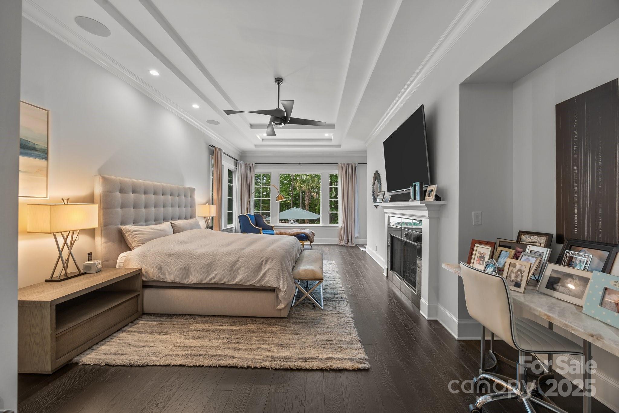 10170 Enclave Circle Concord, NC 28027 - Photo 19 of 46 a spacious bedroom with a bed and a flat screen tv