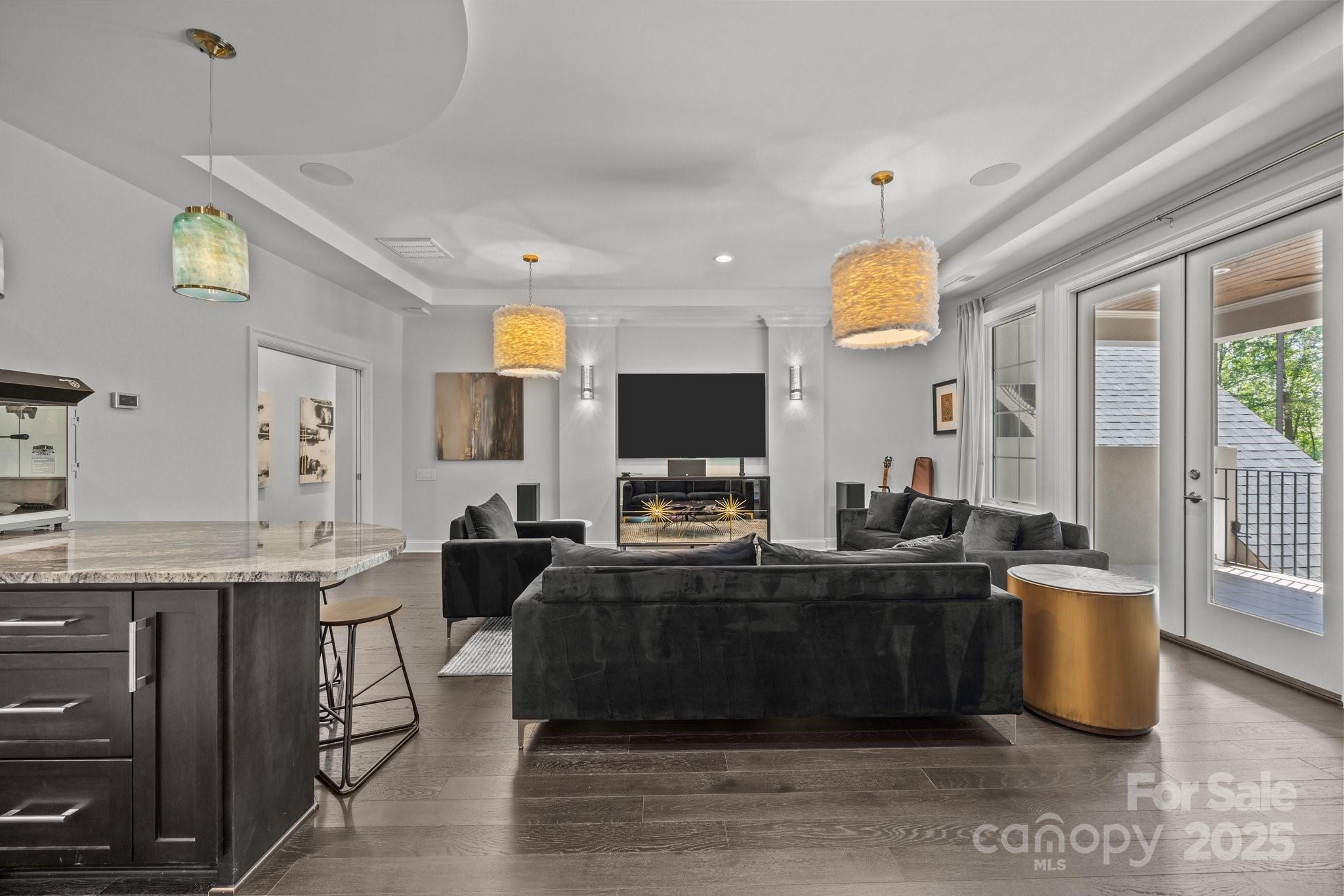 10170 Enclave Circle Concord, NC 28027 - Photo 33 of 46 a living room with furniture a large window and a flat screen tv