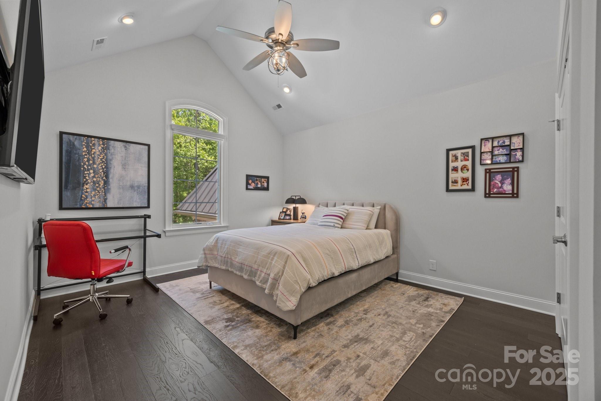 10170 Enclave Circle Concord, NC 28027 - Photo 35 of 46 a bedroom with a bed a rug and a desk