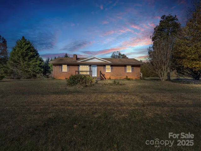 a view of a large house with a yard