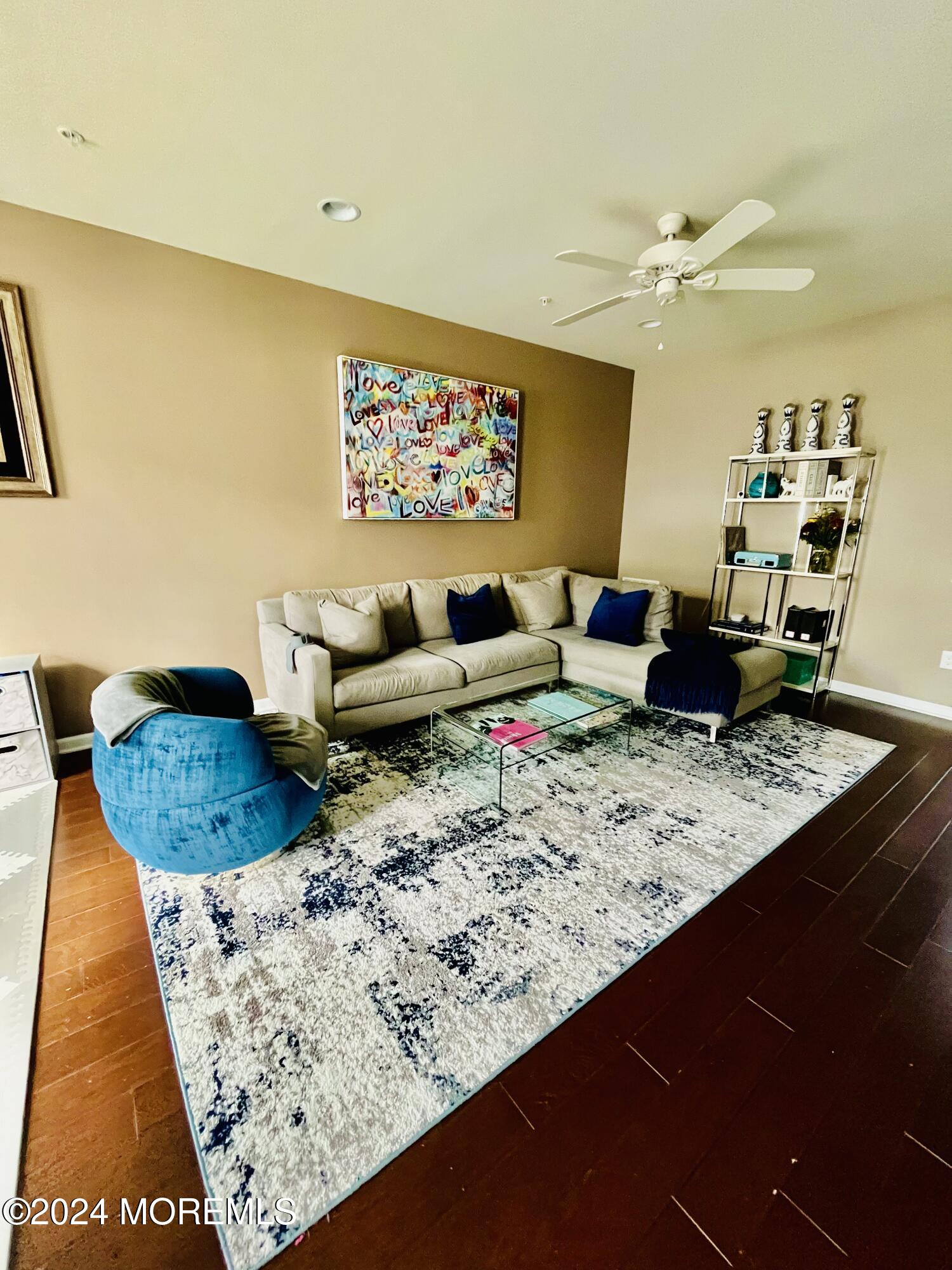115 Beacon Lane, Unit 402 Eatontown, NJ 07724 - Photo 14 of 27 a living room with couch and a rug