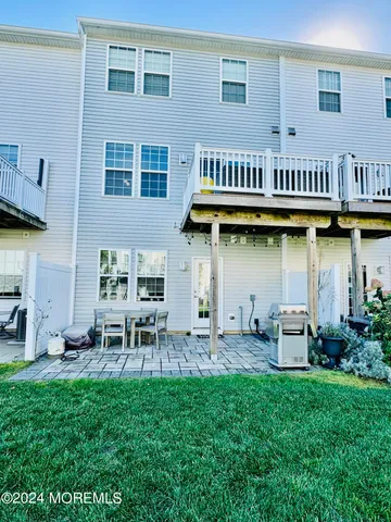 a view of a house with sitting area and garden