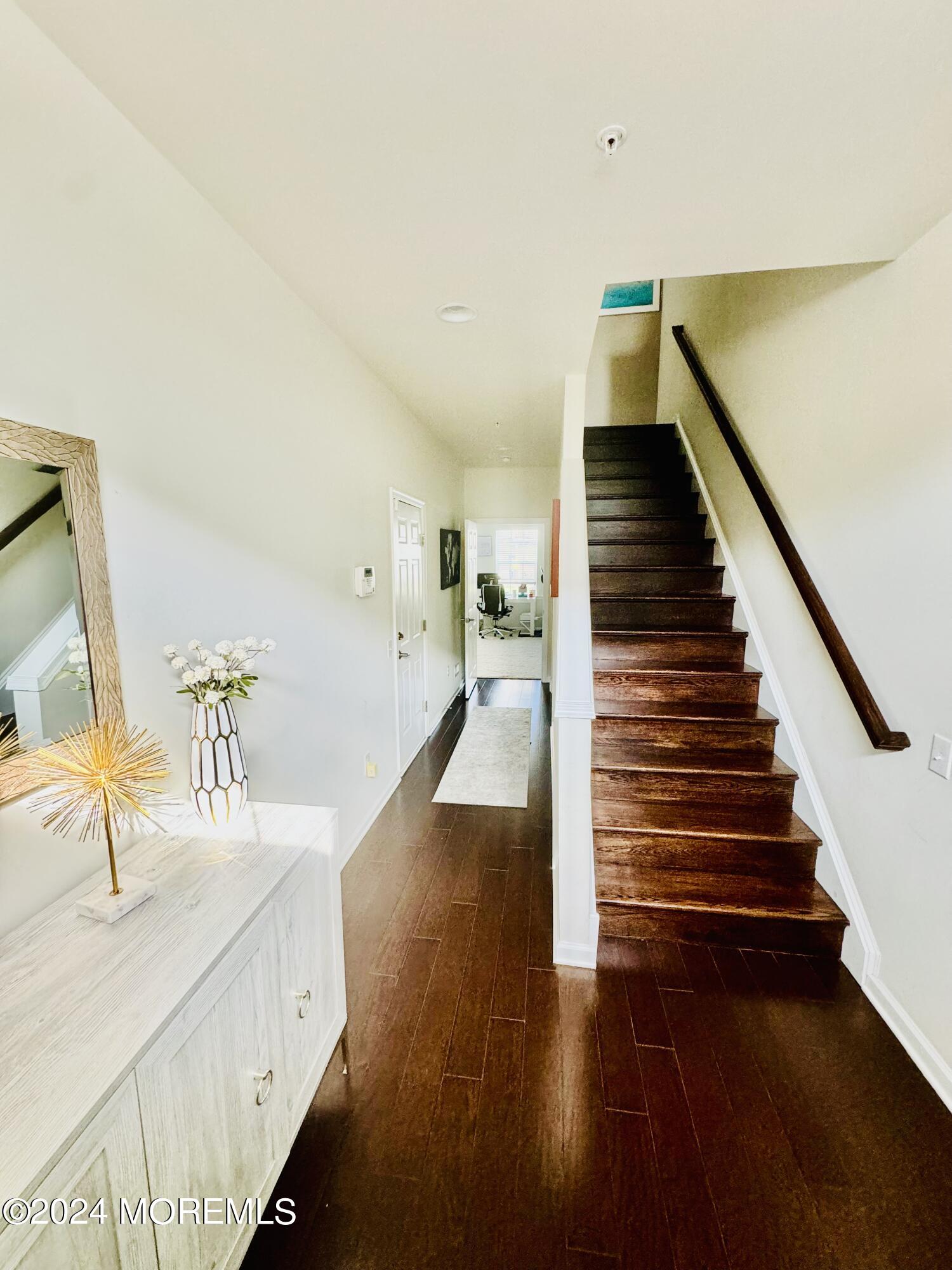 115 Beacon Lane, Unit 402 Eatontown, NJ 07724 - Photo 9 of 27 a view of entryway and hall with wooden floor
