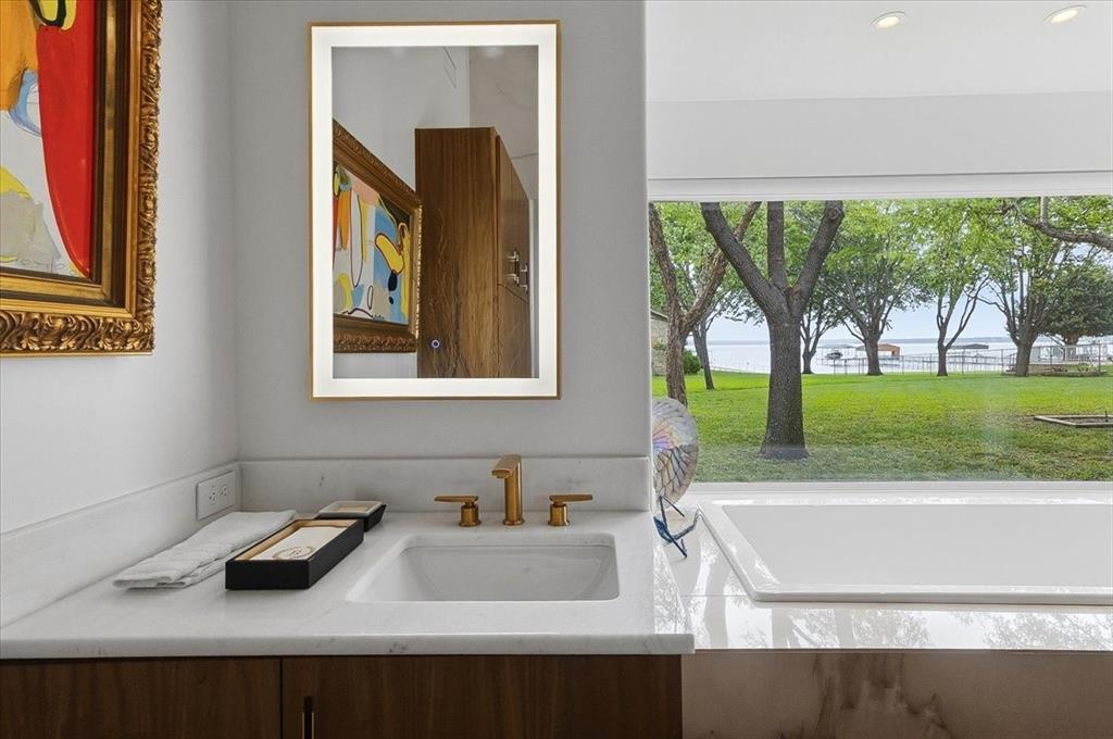 308 North Broadway Road Azle, TX 76020 - Photo 17 of 31 a bathroom with a sink and a large window