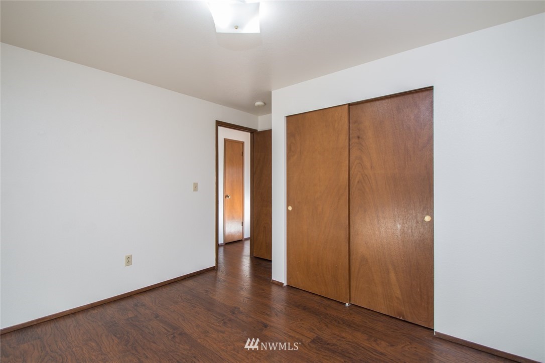 15467 Beaver Marsh Road Mount Vernon, WA 98273 - Photo 18 of 23 an empty room with wooden floor and closet