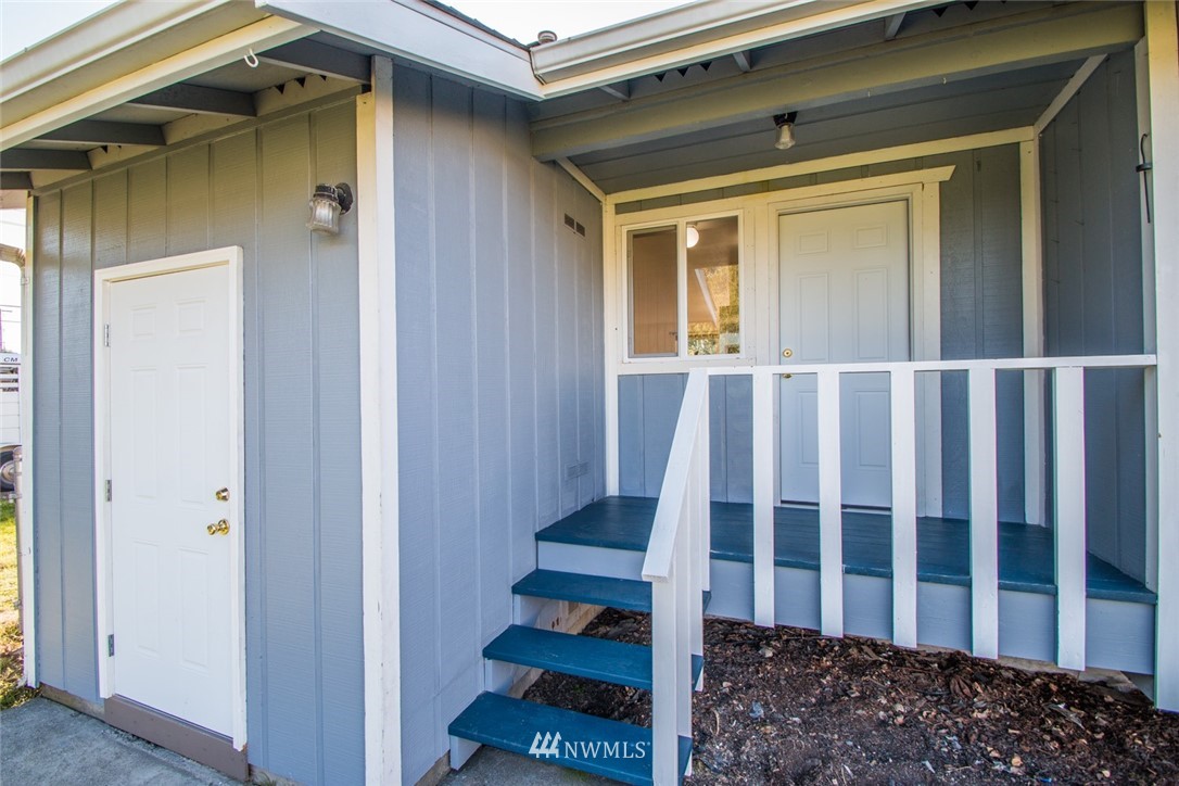15467 Beaver Marsh Road Mount Vernon, WA 98273 - Photo 4 of 23 a view of a porch with wooden floor and fence