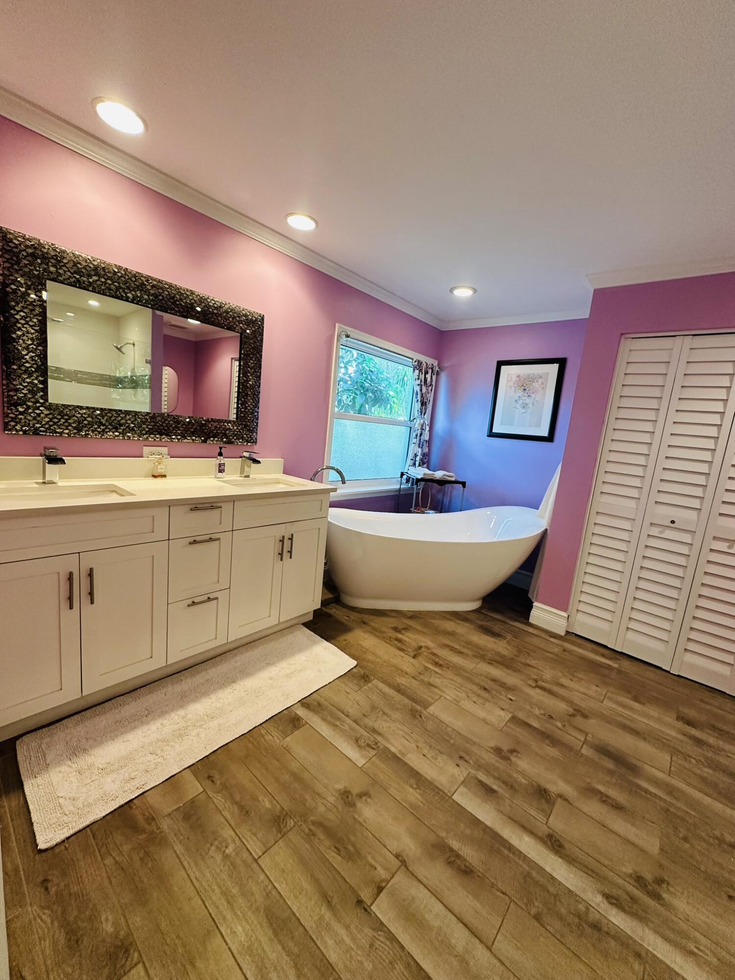 2415 Laurel Lane Palm Beach Gardens, FL 33410 - Photo 16 of 18 a living room with a flat screen tv and a fireplace